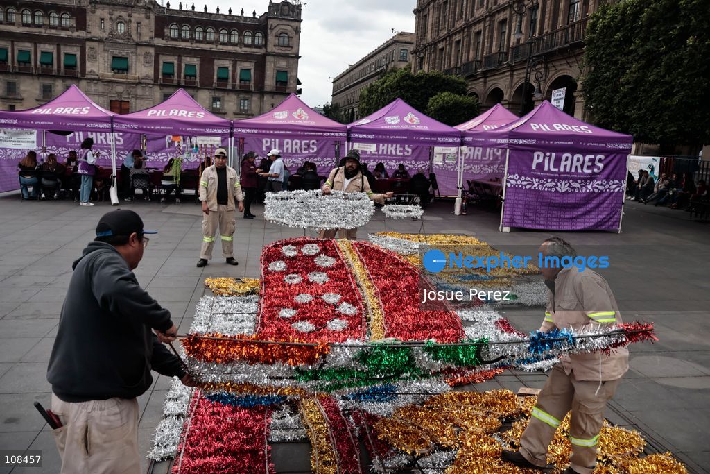 City workers begin assembling on the ground the installation that will be placed on buildings to celebrate the Day of the Dead, on October 22, 2026, in Mexico City, Mexico. Construction crews working for the Mexico City government have begun assembling and installing the structures that will illuminate the buildings surrounding the city’s Zócalo. Using cranes, cables, and various framework components, they are preparing everything for the unveiling of the Monumental Ofrenda (altar), which will feature the world’s tallest Catrina, so that both locals and tourists can enjoy the start of the Day of the Dead celebrations in Mexico. (Photo by Josue Perez/Nexpher Images)
