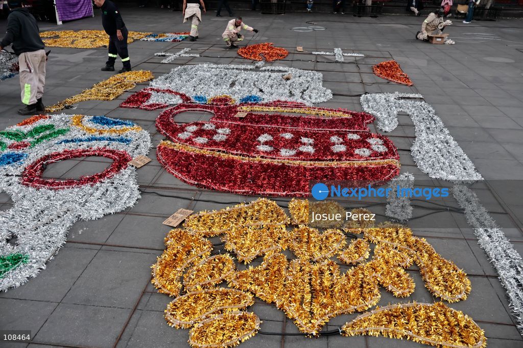 City workers begin assembling on the ground the installation that will be placed on buildings to celebrate the Day of the Dead, on October 22, 2026, in Mexico City, Mexico. Construction crews working for the Mexico City government have begun assembling and installing the structures that will illuminate the buildings surrounding the city’s Zócalo. Using cranes, cables, and various framework components, they are preparing everything for the unveiling of the Monumental Ofrenda (altar), which will feature the world’s tallest Catrina, so that both locals and tourists can enjoy the start of the Day of the Dead celebrations in Mexico. (Photo by Josue Perez/Nexpher Images)