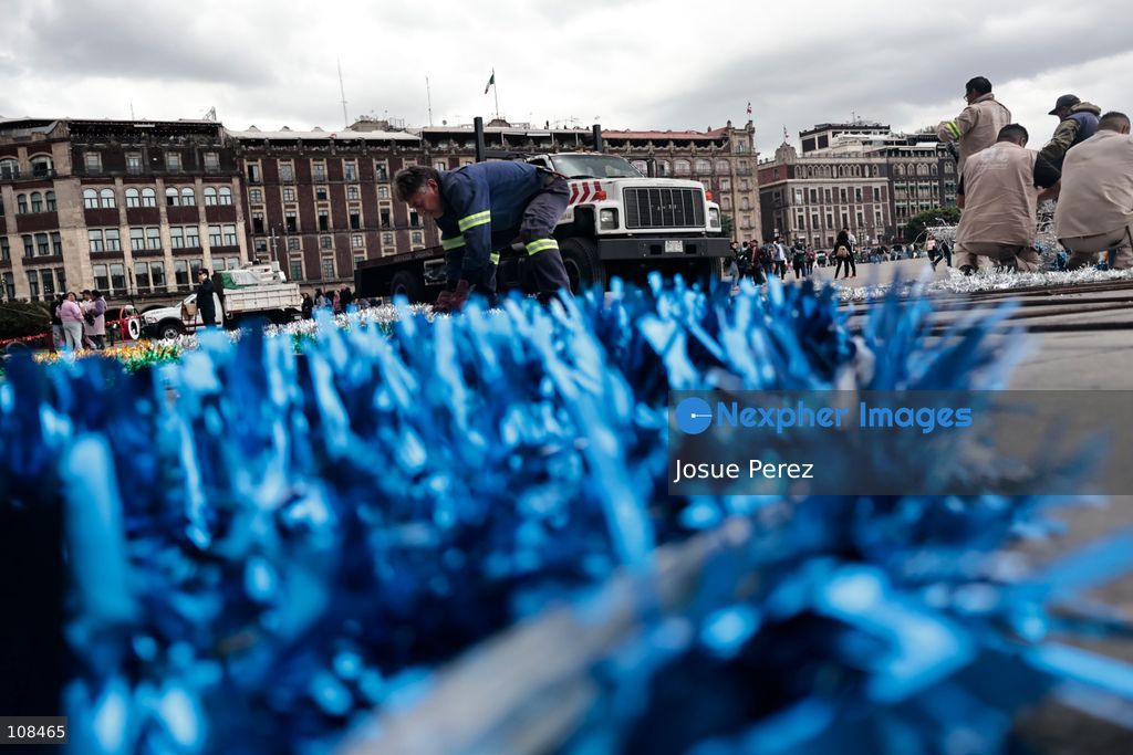 City workers begin assembling on the ground the installation that will be placed on buildings to celebrate the Day of the Dead, on October 22, 2026, in Mexico City, Mexico. Construction crews working for the Mexico City government have begun assembling and installing the structures that will illuminate the buildings surrounding the city’s Zócalo. Using cranes, cables, and various framework components, they are preparing everything for the unveiling of the Monumental Ofrenda (altar), which will feature the world’s tallest Catrina, so that both locals and tourists can enjoy the start of the Day of the Dead celebrations in Mexico.