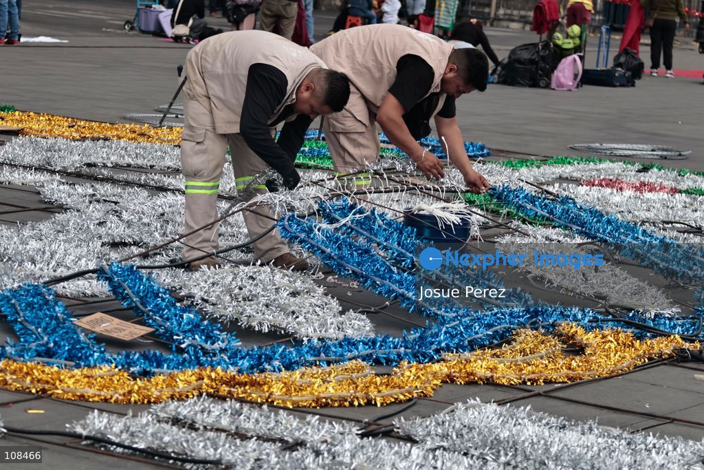 City workers begin assembling on the ground the installation that will be placed on buildings to celebrate the Day of the Dead, on October 22, 2026, in Mexico City, Mexico. Construction crews working for the Mexico City government have begun assembling and installing the structures that will illuminate the buildings surrounding the city’s Zócalo. Using cranes, cables, and various framework components, they are preparing everything for the unveiling of the Monumental Ofrenda (altar), which will feature the world’s tallest Catrina, so that both locals and tourists can enjoy the start of the Day of the Dead celebrations in Mexico.