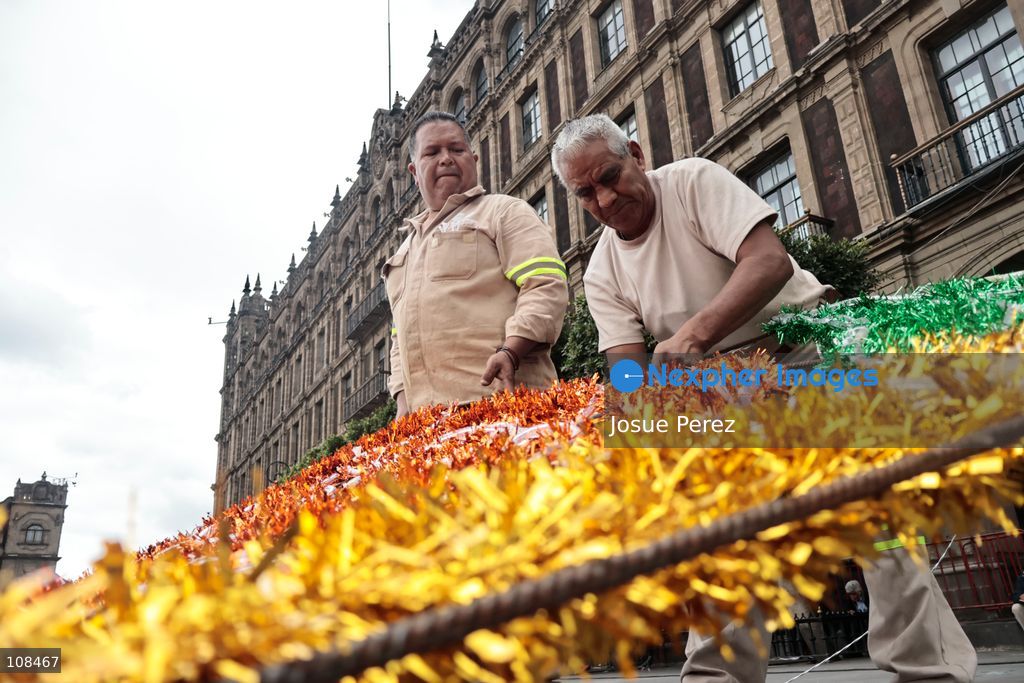 City workers begin assembling on the ground the installation that will be placed on buildings to celebrate the Day of the Dead, on October 22, 2026, in Mexico City, Mexico. Construction crews working for the Mexico City government have begun assembling and installing the structures that will illuminate the buildings surrounding the city’s Zócalo. Using cranes, cables, and various framework components, they are preparing everything for the unveiling of the Monumental Ofrenda (altar), which will feature the world’s tallest Catrina, so that both locals and tourists can enjoy the start of the Day of the Dead celebrations in Mexico.