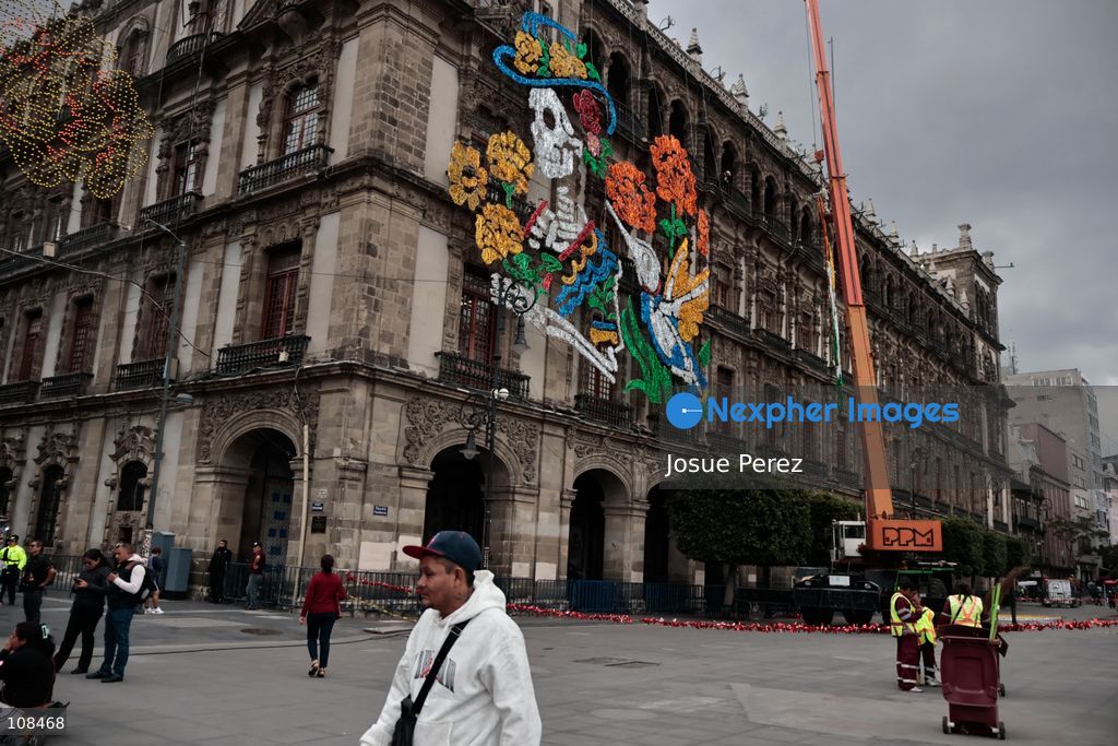 Construction crews working for the Mexico City government on October 22, 2026, in Mexico City, Mexico. Workers begun assembling and installing the structures that will illuminate the buildings surrounding the city’s Zócalo. Using cranes, cables, and various framework components, they are preparing everything for the unveiling of the Monumental Ofrenda (altar), which will feature the world’s tallest Catrina, so that both locals and tourists can enjoy the start of the Day of the Dead celebrations in Mexico. (Photo by Josue Perez/Nexpher Images)