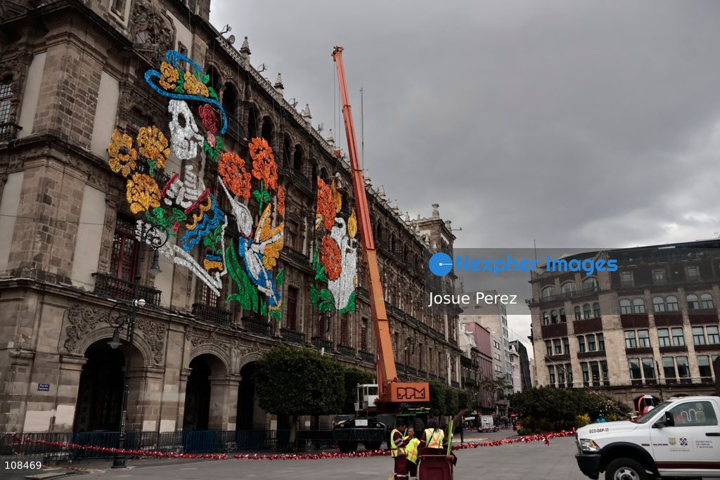 Construction crews working for the Mexico City government on October 22, 2026, in Mexico City, Mexico. Workers begun assembling and installing the structures that will illuminate the buildings surrounding the city’s Zócalo. Using cranes, cables, and various framework components, they are preparing everything for the unveiling of the Monumental Ofrenda (altar), which will feature the world’s tallest Catrina, so that both locals and tourists can enjoy the start of the Day of the Dead celebrations in Mexico. (Photo by Josue Perez/Nexpher Images)