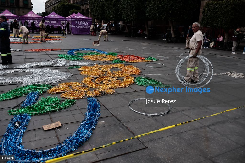 City workers begin assembling on the ground the installation that will be placed on buildings to celebrate the Day of the Dead, on October 22, 2026, in Mexico City, Mexico. Construction crews working for the Mexico City government have begun assembling and installing the structures that will illuminate the buildings surrounding the city’s Zócalo. Using cranes, cables, and various framework components, they are preparing everything for the unveiling of the Monumental Ofrenda (altar), which will feature the world’s tallest Catrina, so that both locals and tourists can enjoy the start of the Day of the Dead celebrations in Mexico. (Photo by Josue Perez/Nexpher Images)