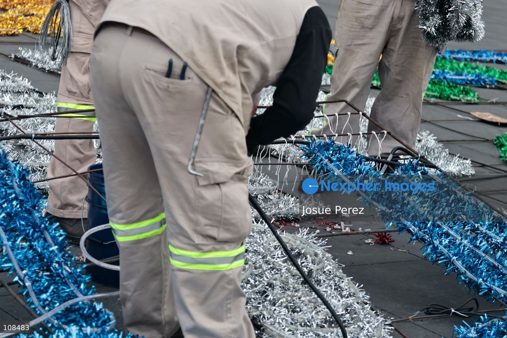 City workers begin assembling on the ground the installation that will be placed on buildings to celebrate the Day of the Dead, on October 22, 2026, in Mexico City, Mexico. Construction crews working for the Mexico City government have begun assembling and installing the structures that will illuminate the buildings surrounding the city’s Zócalo. Using cranes, cables, and various framework components, they are preparing everything for the unveiling of the Monumental Ofrenda (altar), which will feature the world’s tallest Catrina, so that both locals and tourists can enjoy the start of the Day of the Dead celebrations in Mexico. (Photo by Josue Perez/Nexpher Images)