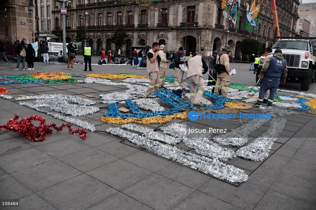 City workers begin assembling on the ground the installation that will be placed on buildings to celebrate the Day of the Dead, on October 22, 2026, in Mexico City, Mexico. Construction crews working for the Mexico City government have begun assembling and installing the structures that will illuminate the buildings surrounding the city’s Zócalo. Using cranes, cables, and various framework components, they are preparing everything for the unveiling of the Monumental Ofrenda (altar), which will feature the world’s tallest Catrina, so that both locals and tourists can enjoy the start of the Day of the Dead celebrations in Mexico. (Photo by Josue Perez/Nexpher Images)