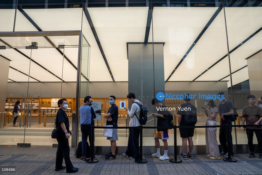 People lining up outside an Apple Store to pick up their iPhone Duo on October 22, 2026 in Hong Kong. The iPhone DUO is Apple INC.’s first foldable phone, today is the first day the new iPhone DUO is available to the public. (Photo by Vernon Yuen/Nexpher Images)
