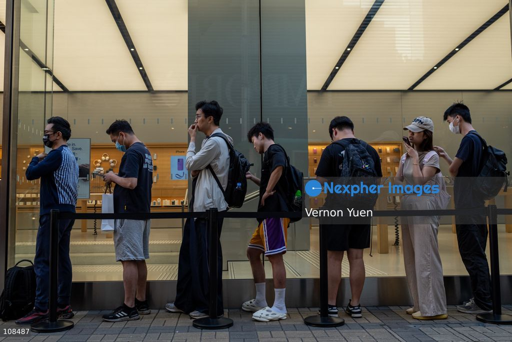 People lining up outside an Apple Store to pick up their iPhone Duo on October 22, 2026 in Hong Kong. The iPhone DUO is Apple INC.’s first foldable phone, today is the first day the new iPhone DUO is available to the public. (Photo by Vernon Yuen/Nexpher Images)