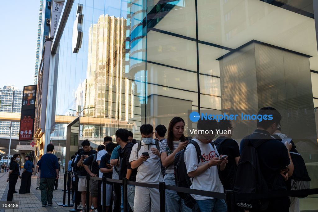 People lining up outside an Apple Store to pick up their iPhone Duo on October 22, 2026 in Hong Kong. The iPhone DUO is Apple INC.’s first foldable phone, today is the first day the new iPhone DUO is available to the public. (Photo by Vernon Yuen/Nexpher Images)
