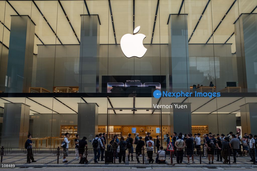 People lining up outside an Apple Store to pick up their iPhone Duo on October 22, 2026 in Hong Kong. The iPhone DUO is Apple INC.’s first foldable phone, today is the first day the new iPhone DUO is available to the public. (Photo by Vernon Yuen/Nexpher Images)