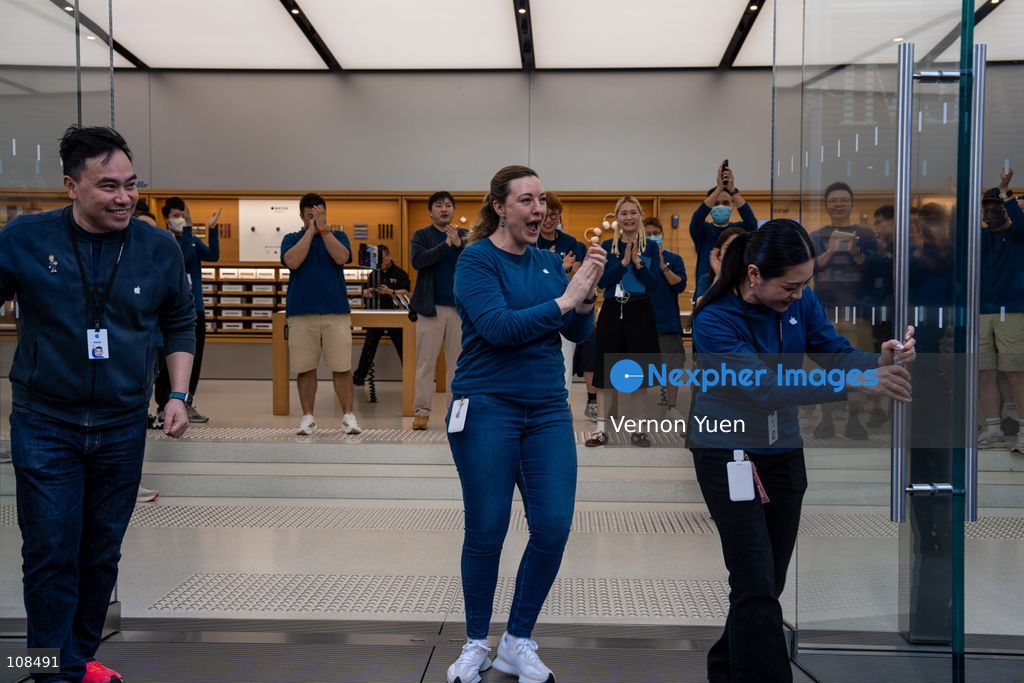 Apple employees welcoming customers picking up their iPhone Duo at an Apple Store on October 22, 2026 in Hong Kong. The iPhone DUO is Apple INC.’s first foldable phone, today is the first day the new iPhone DUO is available to the public. (Photo by Vernon Yuen/Nexpher Images)