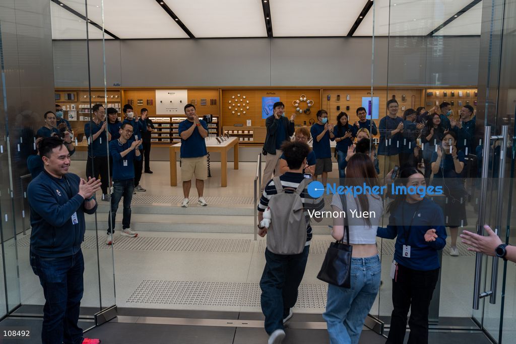 Apple employees welcoming customers picking up their iPhone Duo at an Apple Store on October 22, 2026 in Hong Kong. The iPhone DUO is Apple INC.’s first foldable phone, today is the first day the new iPhone DUO is available to the public. (Photo by Vernon Yuen/Nexpher Images)