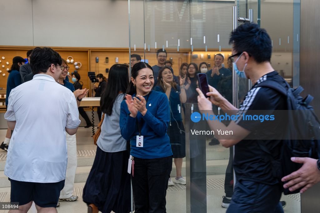 Apple employees welcoming customers picking up their iPhone Duo at an Apple Store on October 22, 2026 in Hong Kong. The iPhone DUO is Apple INC.’s first foldable phone, today is the first day the new iPhone DUO is available to the public. (Photo by Vernon Yuen/Nexpher Images)
