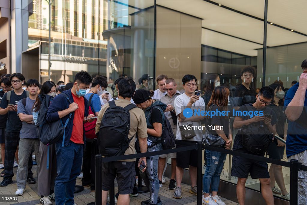 People lining up outside an Apple Store to pick up their iPhone Duo on October 22, 2026 in Hong Kong. The iPhone DUO is Apple INC.’s first foldable phone, today is the first day the new iPhone DUO is available to the public. (Photo by Vernon Yuen/Nexpher Images)