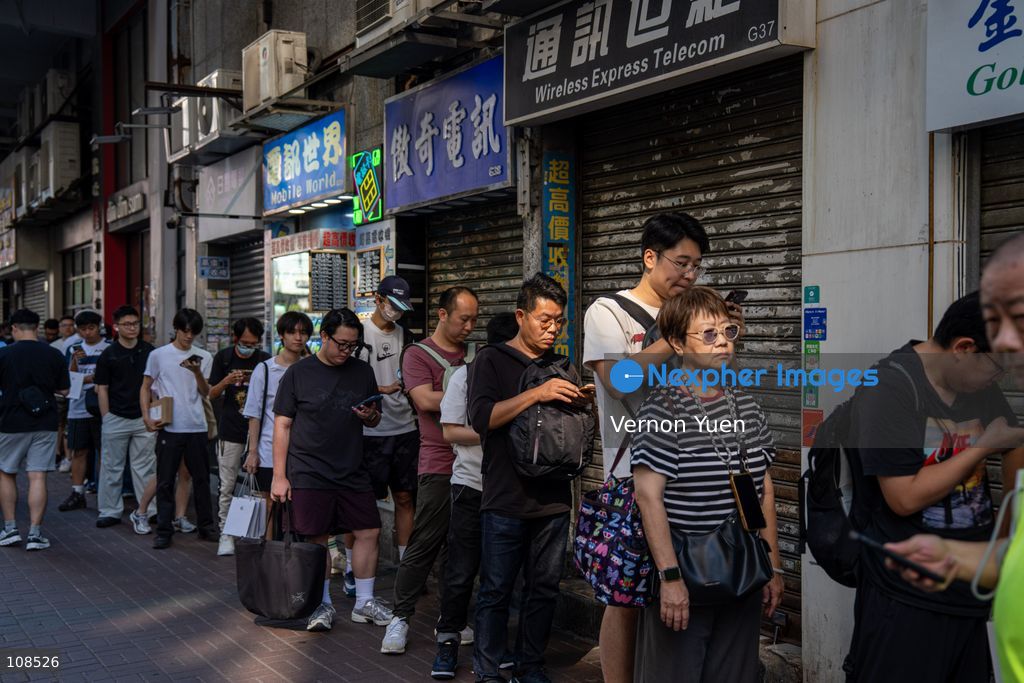 People selling iPhones Duo lining up outside Sin Tat Plaza, a popular iPhone location for phone resellers on October 22, 2026 in Hong Kong. The iPhone DUO is Apple INC.’s first foldable phone, today is the first day the new iPhone DUO is available to the public. (Photo by Vernon Yuen/Nexpher Images)