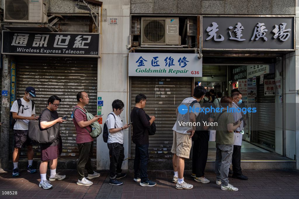 People selling iPhones Duo lining up outside Sin Tat Plaza, a popular iPhone location for phone resellers on October 22, 2026 in Hong Kong. The iPhone DUO is Apple INC.’s first foldable phone, today is the first day the new iPhone DUO is available to the public. (Photo by Vernon Yuen/Nexpher Images)