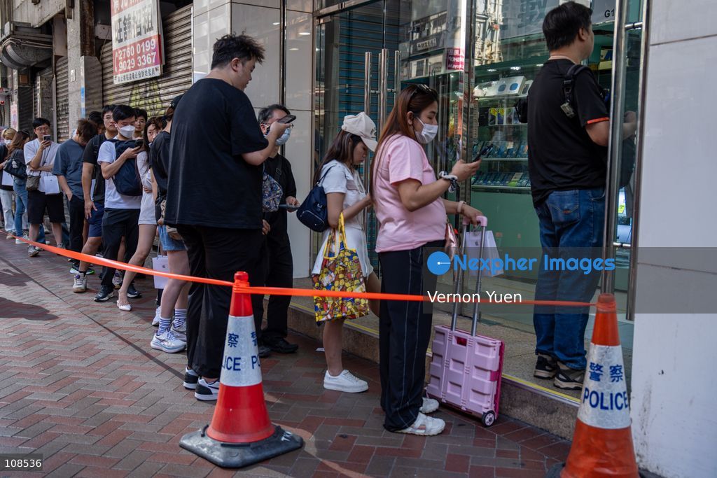 People selling iPhones Duo lining up outside Sin Tat Plaza, a popular iPhone location for phone resellers on October 22, 2026 in Hong Kong. The iPhone DUO is Apple INC.’s first foldable phone, today is the first day the new iPhone DUO is available to the public. (Photo by Vernon Yuen/Nexpher Images)