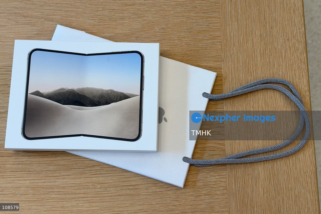 An unopened iPhone Duo box and an Apple shopping bag are pictured at the Apple Causeway Bay store in Hong Kong on October 23, 2026, as Apple's first foldable smartphone officially goes on sale. (Photo by Kevin Li/TMHK via Nexpher Images)