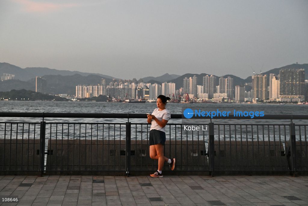 A lady doing exercises at waterfront near the Victoria Harbour on October 23, 2026 in Hong Kong. (Photo by Kobe Li/Nexpher Images)