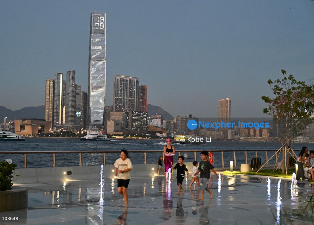 People playing at artificial fountain of waterfront near the Victoria Harbour on October 23, 2026 in Hong Kong. (Photo by Kobe Li/Nexpher Images)
