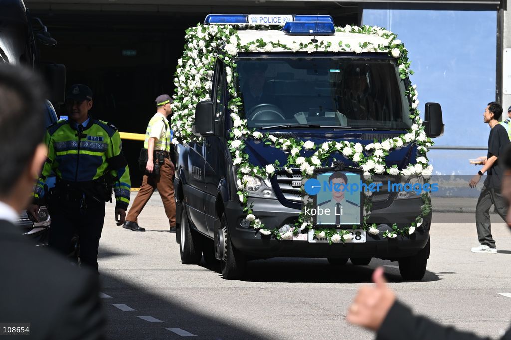 A police hears for the coffin of late police officer Chu Chun-kwok, driving outside of  the Universal Funeral Parlour in Hung Hom on October 23, 2026 in Hong Kong (Photo by kobe Li/Nexpher Images)