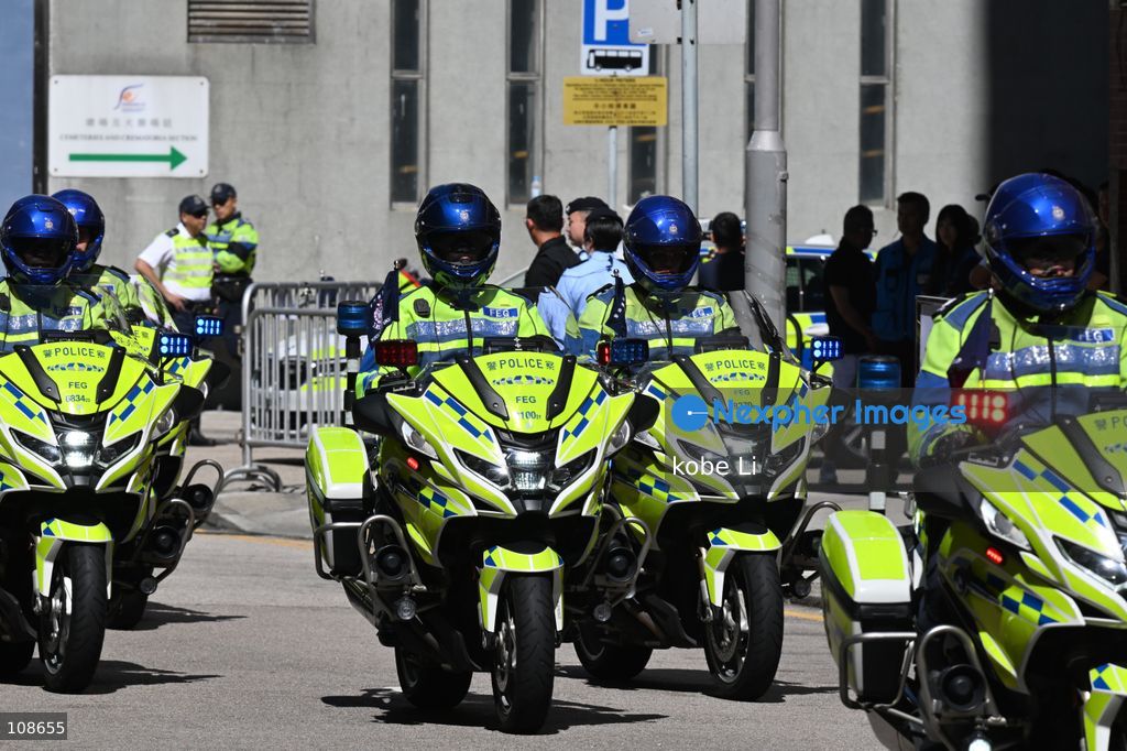 Hong Kong police motorcycle unit
driving during the coffin of late police officer Chu Chun-kwok at Universal Funeral Parlour in Hung Hom on October 23, 2026 in Hong Kong (Photo by kobe Li/Nexpher Images)