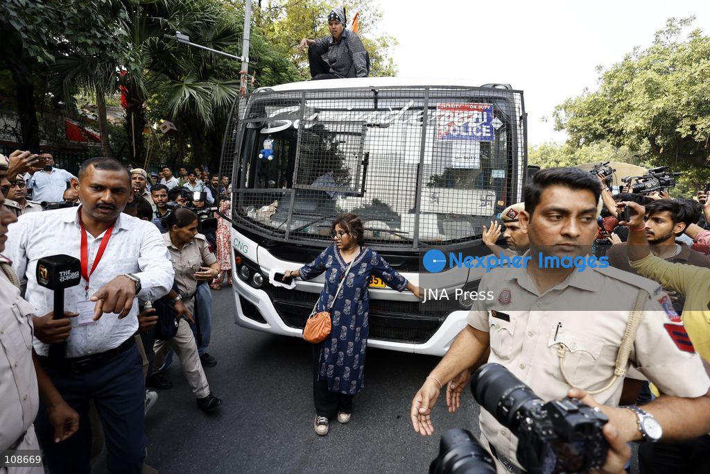 NEW DELHI, INDIA, OCTOBER 23, 2026: Police personnel detain an activist near Bangla Sahib Gurdwara during a protest demanding the resignation of Chief Election Commissioner Gyanesh Kumar. Members of student and civil society organisations attempt to march towards the Election Commission’s headquarters, opposing the Special Intensive Revision (SIR) of electoral rolls. (Photo by Vishal Kapoor/JNA Press via Nexpher Images)