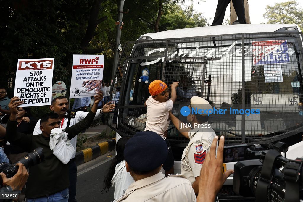 NEW DELHI, INDIA, OCTOBER 23, 2026: Police personnel detain an activist near Bangla Sahib Gurdwara during a protest demanding the resignation of Chief Election Commissioner Gyanesh Kumar. Members of student and civil society organisations attempt to march towards the Election Commission’s headquarters, opposing the Special Intensive Revision (SIR) of electoral rolls. (Photo by Vishal Kapoor/JNA Press via Nexpher Images)