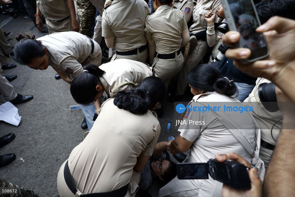 NEW DELHI, INDIA, OCTOBER 23, 2026: Police personnel detain an activist near Bangla Sahib Gurdwara during a protest demanding the resignation of Chief Election Commissioner Gyanesh Kumar. Members of student and civil society organisations attempt to march towards the Election Commission’s headquarters, opposing the Special Intensive Revision (SIR) of electoral rolls. (Photo by Vishal Kapoor/JNA Press via Nexpher Images)