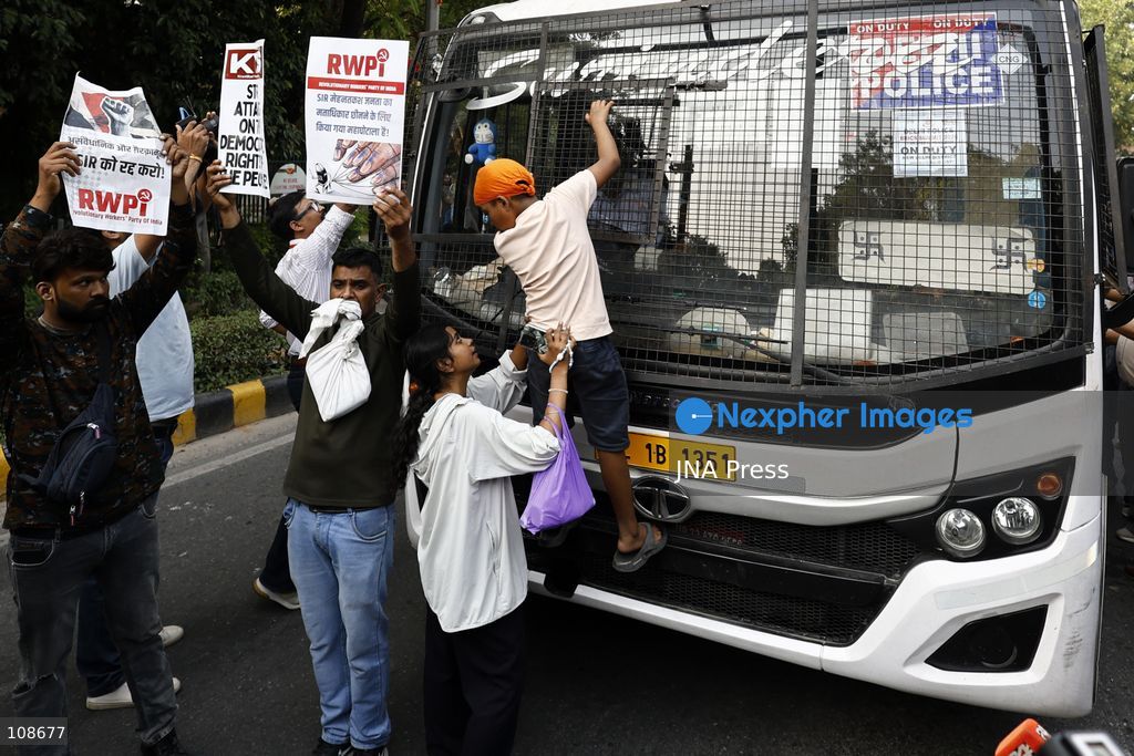 NEW DELHI, INDIA, OCTOBER 23, 2026: Police personnel detain an activist near Bangla Sahib Gurdwara during a protest demanding the resignation of Chief Election Commissioner Gyanesh Kumar. Members of student and civil society organisations attempt to march towards the Election Commission’s headquarters, opposing the Special Intensive Revision (SIR) of electoral rolls. (Photo by Vishal Kapoor/JNA Press via Nexpher Images)