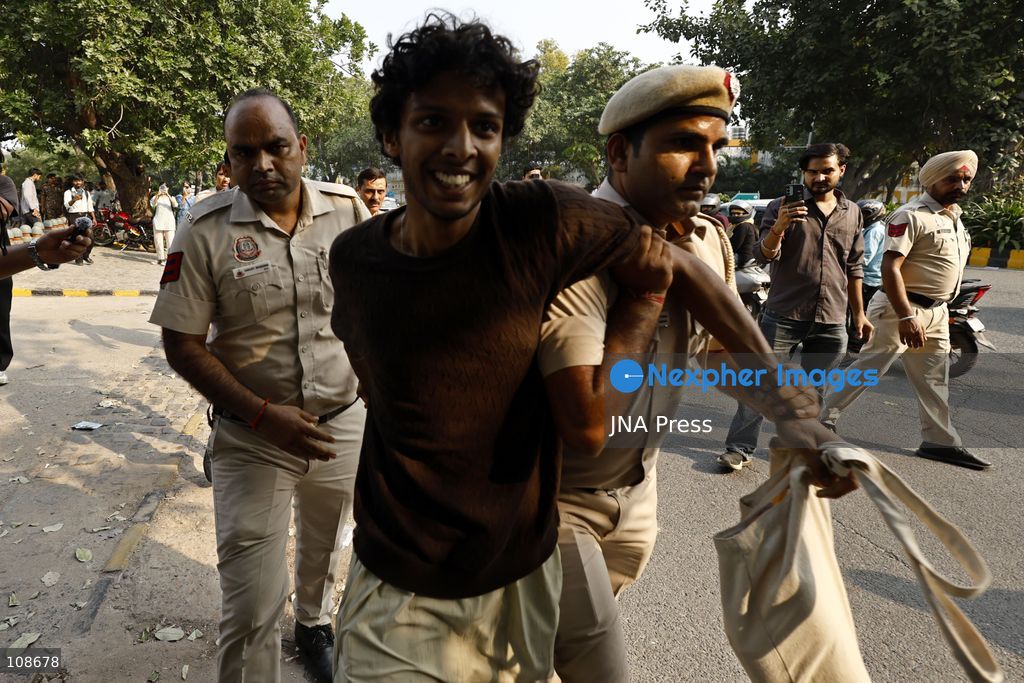 NEW DELHI, INDIA, OCTOBER 23, 2026: Police personnel detain an activist near Bangla Sahib Gurdwara during a protest demanding the resignation of Chief Election Commissioner Gyanesh Kumar. Members of student and civil society organisations attempt to march towards the Election Commission’s headquarters, opposing the Special Intensive Revision (SIR) of electoral rolls. (Photo by Vishal Kapoor/JNA Press via Nexpher Images)