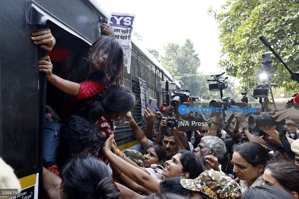 NEW DELHI, INDIA, OCTOBER 23, 2026: Police personnel detain an activist near Bangla Sahib Gurdwara during a protest demanding the resignation of Chief Election Commissioner Gyanesh Kumar. Members of student and civil society organisations attempt to march towards the Election Commission’s headquarters, opposing the Special Intensive Revision (SIR) of electoral rolls. (Photo by Vishal Kapoor/JNA Press via Nexpher Images)