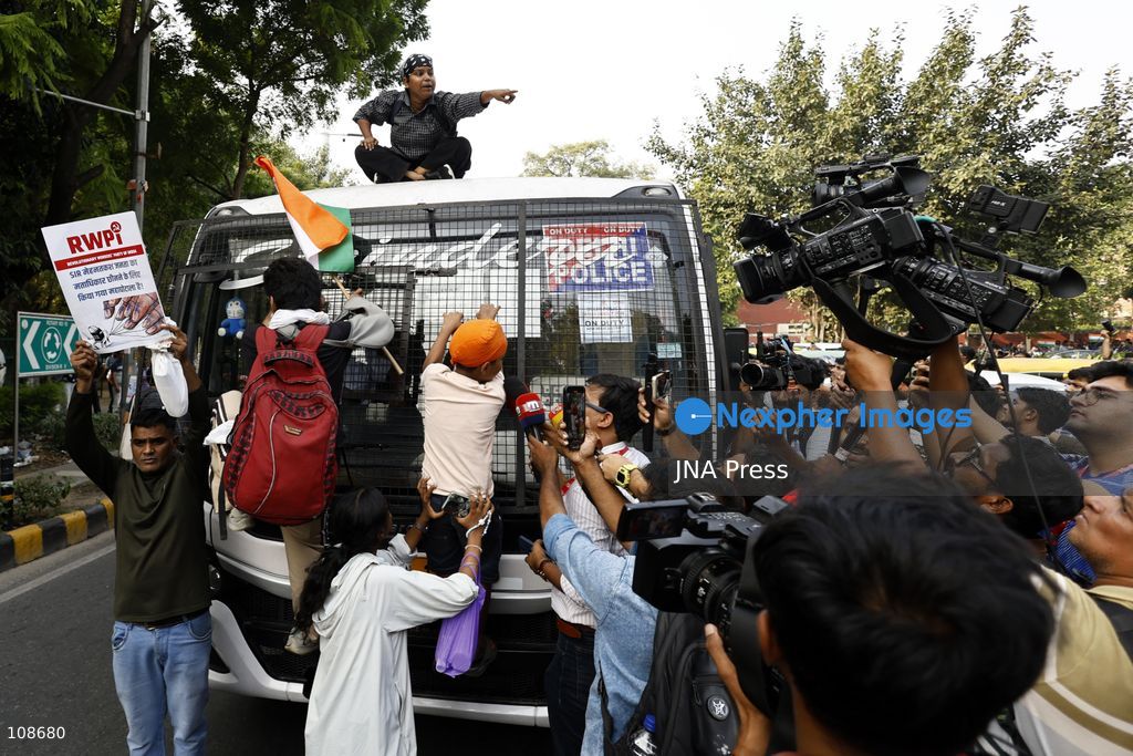 NEW DELHI, INDIA, OCTOBER 23, 2026: Police personnel detain an activist near Bangla Sahib Gurdwara during a protest demanding the resignation of Chief Election Commissioner Gyanesh Kumar. Members of student and civil society organisations attempt to march towards the Election Commission’s headquarters, opposing the Special Intensive Revision (SIR) of electoral rolls. (Photo by Vishal Kapoor/JNA Press via Nexpher Images)