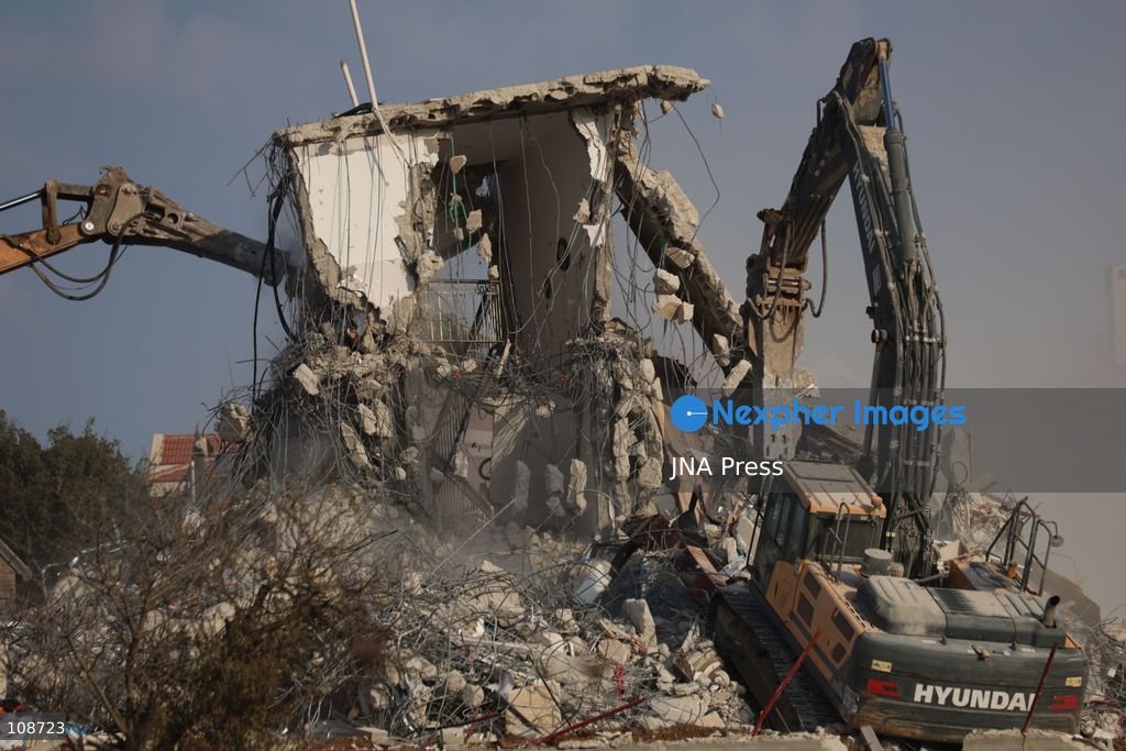 HEBRON, PALESTINE, OCTOBER 23, 2026: Israeli forces demolish a Palestinian residential building in the Farsh al-Hawa area of Hebron in the occupied West Bank. The demolition follows a shooting attack at a nearby military checkpoint earlier in the day and Israeli orders targeting buildings around the attack site. (Photo by Mosab shawer/JNA Press via Nexpher Images)