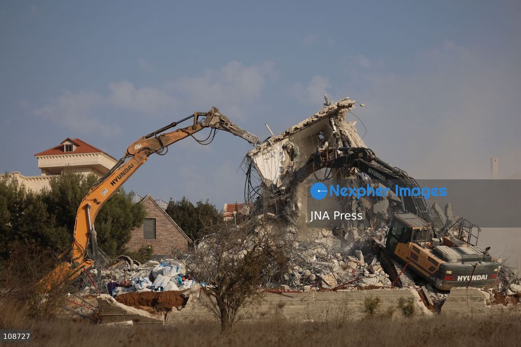 HEBRON, PALESTINE, OCTOBER 23, 2026: Israeli forces demolish a Palestinian residential building in the Farsh al-Hawa area of Hebron in the occupied West Bank. The demolition follows a shooting attack at a nearby military checkpoint earlier in the day and Israeli orders targeting buildings around the attack site. (Photo by Mosab shawer/JNA Press via Nexpher Images)