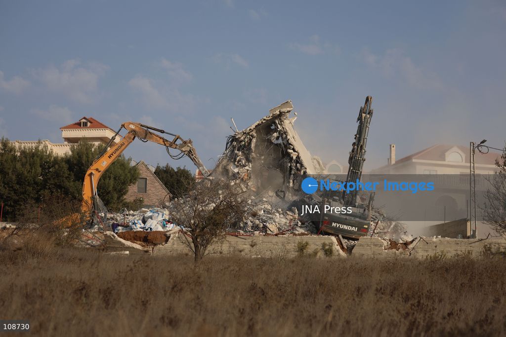 HEBRON, PALESTINE, OCTOBER 23, 2026: Israeli forces demolish a Palestinian residential building in the Farsh al-Hawa area of Hebron in the occupied West Bank. The demolition follows a shooting attack at a nearby military checkpoint earlier in the day and Israeli orders targeting buildings around the attack site. (Photo by Mosab shawer/JNA Press via Nexpher Images)
