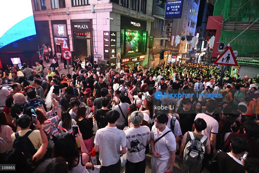 Visitors cosplaying and posing photo at Lan Kwai Fong in Central on the eve of Halloween on October 24, 2026 in Hong Kong. (Photo by kobe Li/Nexpher Images)
