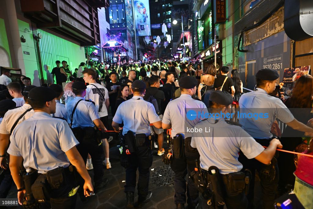 Hong Kong police implemented crowd control measures during visitors visiting at Lan Kwai Fong in Central on the eve of Halloween on October 24, 2026 in Hong Kong. (Photo by kobe Li/Nexpher Images)