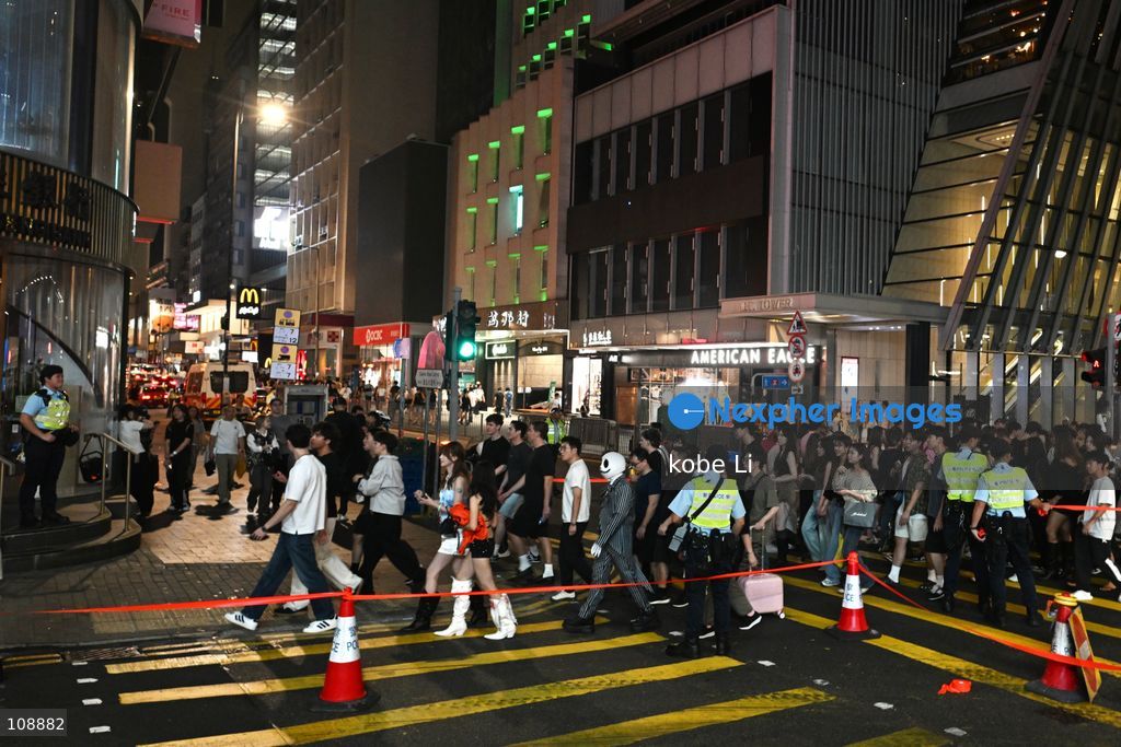 Hong Kong police implemented crowd control measures during visitors visiting at Lan Kwai Fong in Central on the eve of Halloween on October 24, 2026 in Hong Kong. (Photo by kobe Li/Nexpher Images)