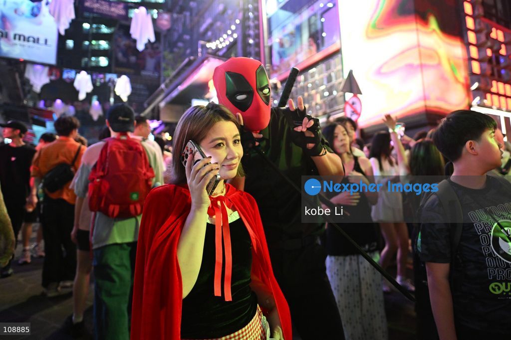 Visitors cosplaying and posing photo at Lan Kwai Fong in Central on the eve of Halloween on October 24, 2026 in Hong Kong. (Photo by kobe Li/Nexpher Images)