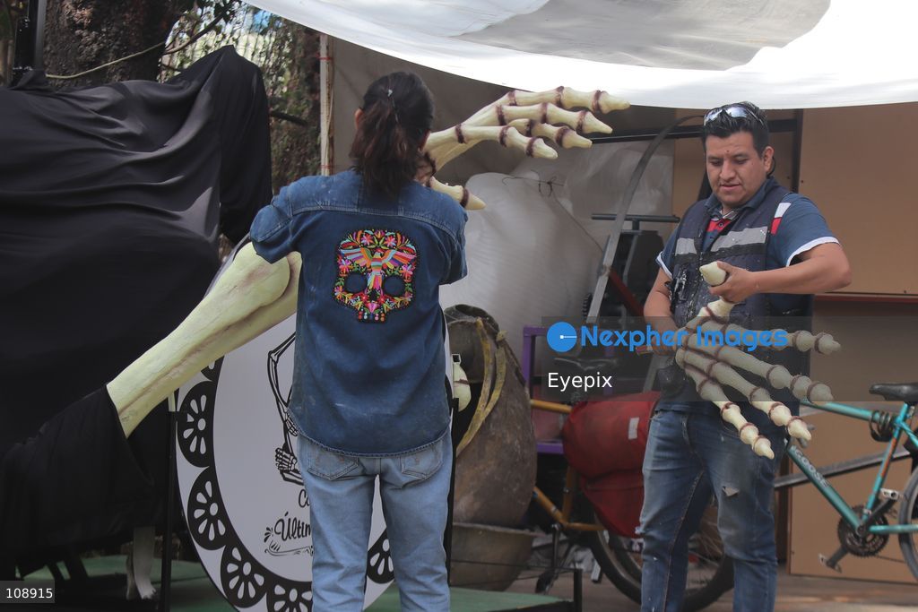 Artisans and members of the Última Hora collective manufacturing papier-mâché and metallic structures to build an allegorical float inspired by the classic Mexican song 'El panadero con el pan' ahead of Mexico City’s upcoming Day of the Dead parade, at the Faro de Oriente workshops in Iztapalapa. The annual cultural celebration brings together community artists and creators to showcase traditional Mexican folklore. on October 24, 2026 in Mexico City, Mexico. (Photo by Carlos Santiago/ Eyepix Group/Eyepix via Nexpher Images)