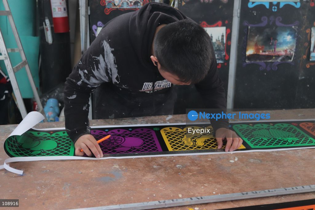 An Artisan member of the Última Hora collective manufacturing papier-mâché and metallic structures to build an allegorical float inspired by the classic Mexican song 'El panadero con el pan' ahead of Mexico City’s upcoming Day of the Dead parade, at the Faro de Oriente workshops in Iztapalapa. The annual cultural celebration brings together community artists and creators to showcase traditional Mexican folklore. on October 24, 2026 in Mexico City, Mexico. (Photo by Carlos Santiago/ Eyepix Group/Eyepix via Nexpher Images)