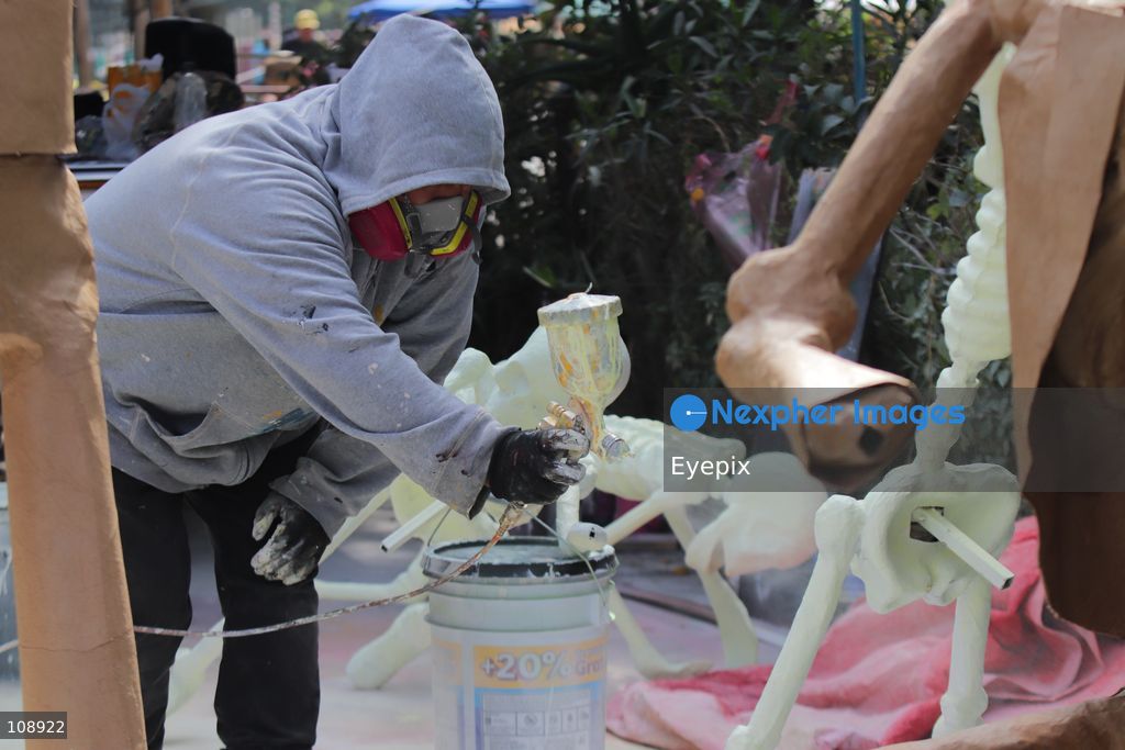 An Artisan member of the Última Hora collective manufacturing papier-mâché and metallic structures to build an allegorical float inspired by the classic Mexican song 'El panadero con el pan' ahead of Mexico City’s upcoming Day of the Dead parade, at the Faro de Oriente workshops in Iztapalapa. The annual cultural celebration brings together community artists and creators to showcase traditional Mexican folklore. on October 24, 2026 in Mexico City, Mexico. (Photo by Carlos Santiago/ Eyepix Group/Eyepix via Nexpher Images)