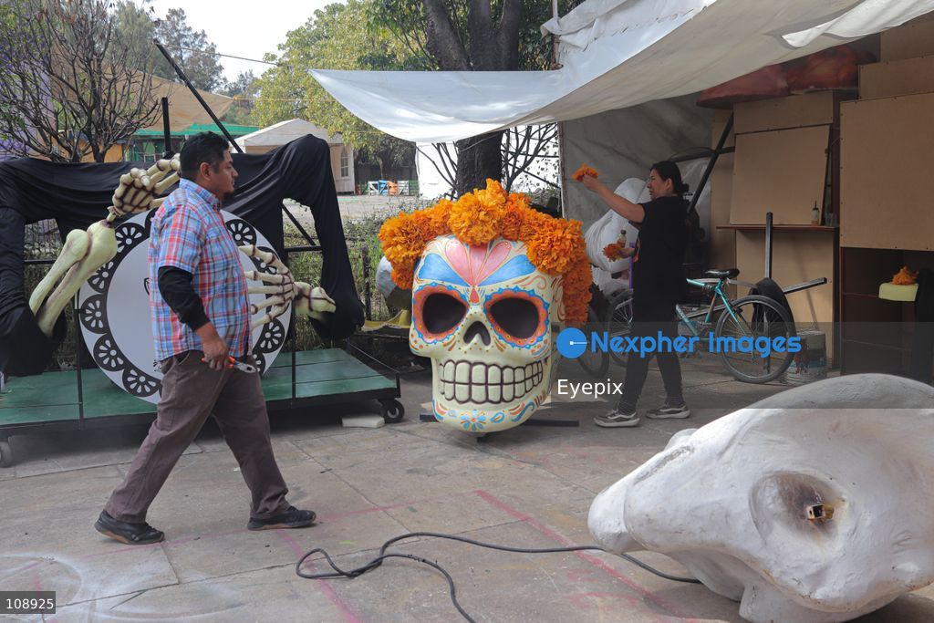 Artisans and members of the Última Hora collective manufacturing papier-mâché and metallic structures to build an allegorical float inspired by the classic Mexican song 'El panadero con el pan' ahead of Mexico City’s upcoming Day of the Dead parade, at the Faro de Oriente workshops in Iztapalapa. The annual cultural celebration brings together community artists and creators to showcase traditional Mexican folklore. on October 24, 2026 in Mexico City, Mexico. (Photo by Carlos Santiago/ Eyepix Group/Eyepix via Nexpher Images)