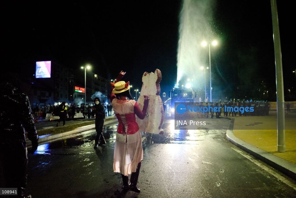 TURIN, ITALY, OCTOBER 24, 2026: Riot police use water cannons and tear gas during confrontations with demonstrators protesting against military rearmament, rising living costs and government policies in Turin. The march begins in Piazza Castello before moving towards northern districts, with clashes occurring as police block protesters from entering streets leading towards the city centre. (Photo by Chiara Antenucci/JNA Press via Nexpher Images)