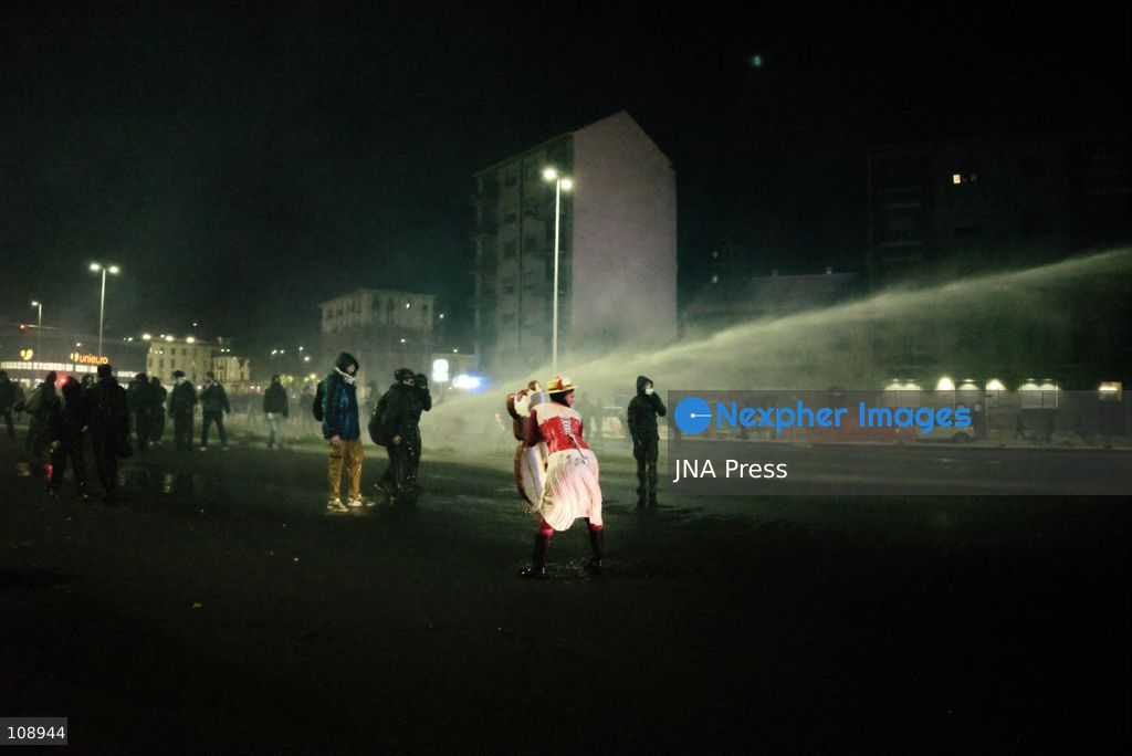 TURIN, ITALY, OCTOBER 24, 2026: Riot police use water cannons and tear gas during confrontations with demonstrators protesting against military rearmament, rising living costs and government policies in Turin. The march begins in Piazza Castello before moving towards northern districts, with clashes occurring as police block protesters from entering streets leading towards the city centre. (Photo by Chiara Antenucci/JNA Press via Nexpher Images)