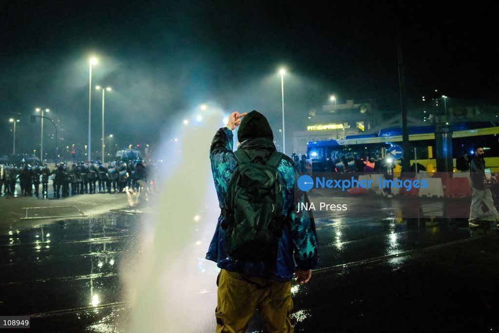 TURIN, ITALY, OCTOBER 24, 2026: Riot police use water cannons and tear gas during confrontations with demonstrators protesting against military rearmament, rising living costs and government policies in Turin. The march begins in Piazza Castello before moving towards northern districts, with clashes occurring as police block protesters from entering streets leading towards the city centre. (Photo by Chiara Antenucci/JNA Press via Nexpher Images)