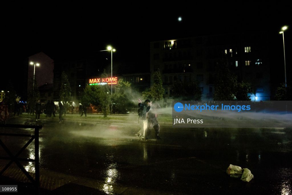 TURIN, ITALY, OCTOBER 24, 2026: Riot police use water cannons and tear gas during confrontations with demonstrators protesting against military rearmament, rising living costs and government policies in Turin. The march begins in Piazza Castello before moving towards northern districts, with clashes occurring as police block protesters from entering streets leading towards the city centre. (Photo by Chiara Antenucci/JNA Press via Nexpher Images)
