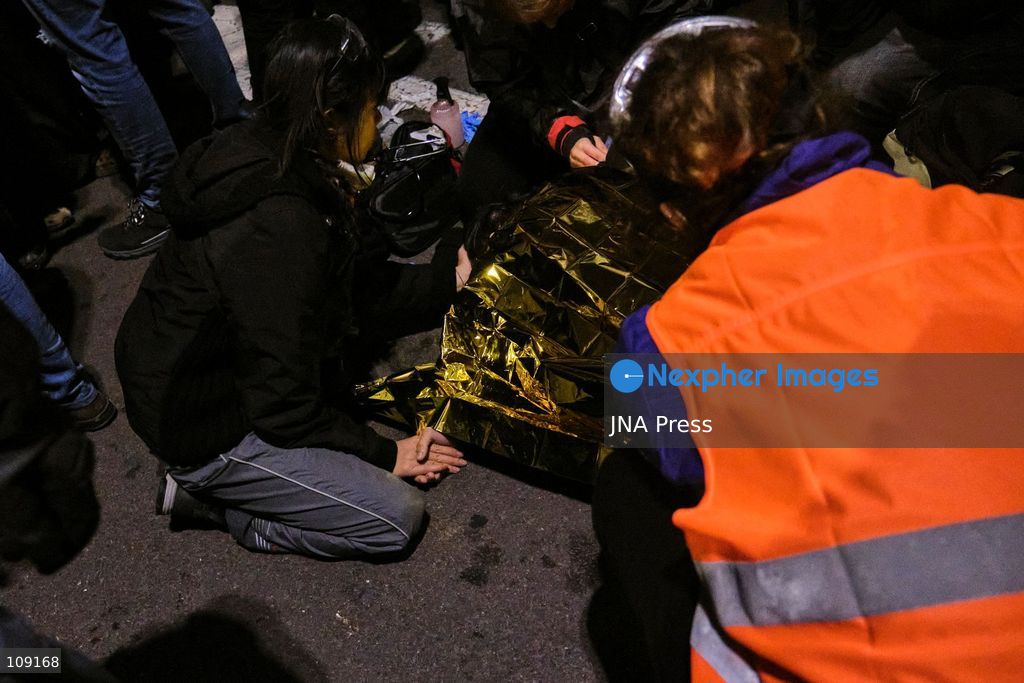 BOLOGNA, ITALY - OCTOBER 24, 2026: Thousands of people gathered spontaneously in Piazza del Nettuno before setting off in a march through the city centre. Clashes broke out along Via Marconi. Several people were injured, and a young man lost consciousness after being tackled by police. A police water cannon was also used from behind the protesters and hit the ambulance that was assisting the unconscious man. In protest, demonstrators sat down in front of the police line, which, after several minutes, decided to disband its wall of shields. (Photo by Lorenzo Pasini/JNA Press via Nexpher Images)