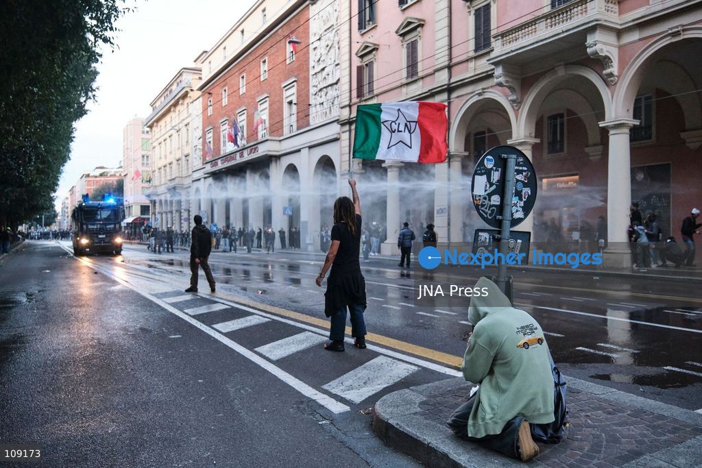 BOLOGNA, ITALY - OCTOBER 24, 2026: Thousands of people gathered spontaneously in Piazza del Nettuno before setting off in a march through the city centre. Clashes broke out along Via Marconi. Several people were injured, and a young man lost consciousness after being tackled by police. A police water cannon was also used from behind the protesters and hit the ambulance that was assisting the unconscious man. In protest, demonstrators sat down in front of the police line, which, after several minutes, decided to disband its wall of shields. (Photo by Lorenzo Pasini/JNA Press via Nexpher Images)